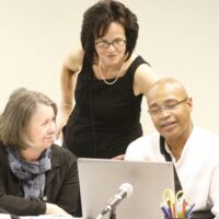 Deborah Ball working with two teachers during a professional development session