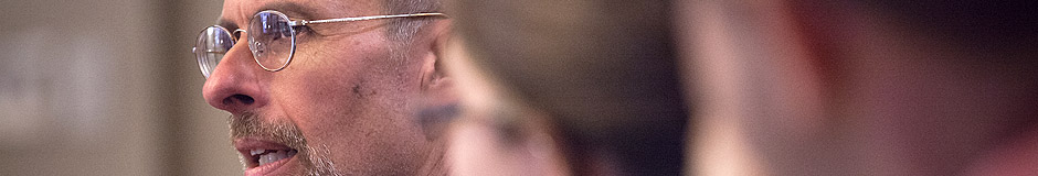 man wearing glasses speaking