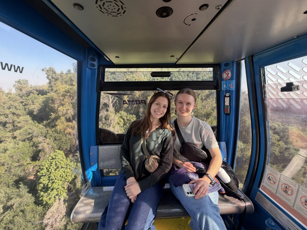 friends riding in a gondola in Santiago, Chile